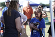 Girl Holding a Ferret