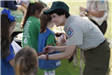 Woman Showing Children a Snake